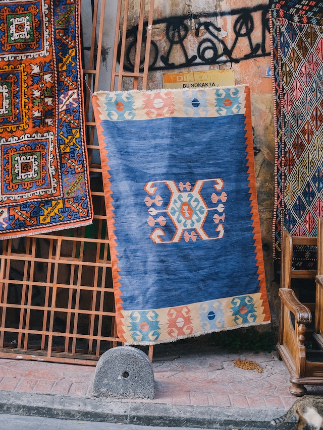 From Practicality to Aesthetics: Tracing the shift from using these rugs solely for functional reasons on ships, to incorporating them as decorative items representing maritime life.